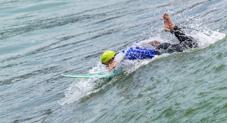 A beautiful shot of a surfer on a low wave
