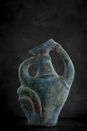 Isolated rustic teal colored textured classic looking vase.の写真素材