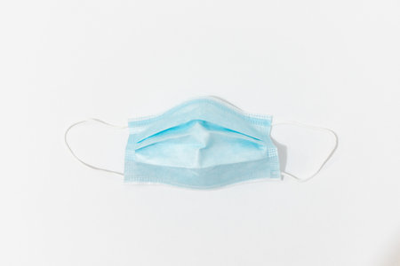 An isolated shot of a disposable facemask on a white background-concept COVID19 pandemic prevention