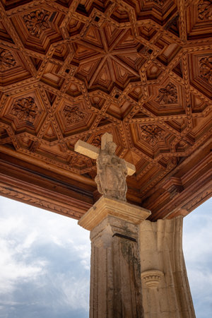 A vertical shot of a gothic style building with a wooden ceiling in Aranda de Duero, Spainの写真素材