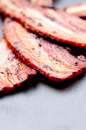 crispy organic heritage smoked bacon from a local organic farmの写真素材