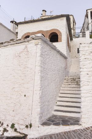 The old stone staircase of the building in Alpujarra of Granada, Andalusia, Spainの写真素材