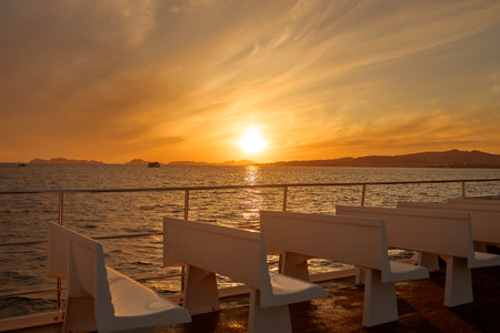 A beautiful view of the sunset from a passenger boat in the Ria de Vigo, Galicia, Spainの写真素材
