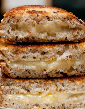 A vertical shot of freshly cut pastry with creamの写真素材