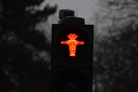 A closeup shot of a red traffic sign on a blurred backgroundの写真素材