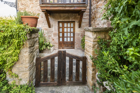A stone country house with a wooden wicketの写真素材