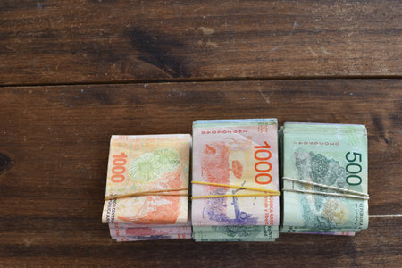 stacks of Argentine peso bills of 500 and 1000 pesos, symbol for inflationの写真素材