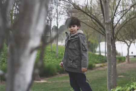 A cute Hispanic male child in a parkの写真素材