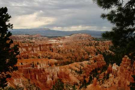 An aerial view of a landscape of a canyon under a cloudy skyの写真素材