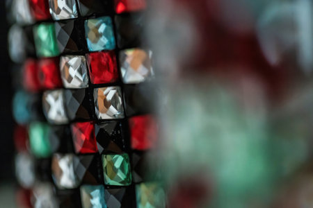 A selective focus shot of colorful mosaic diamond tile backgroundの写真素材