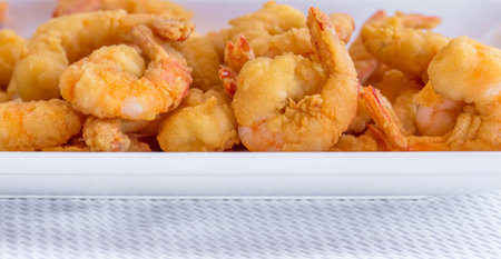 A closeup shot of breaded fried shrimpsの写真素材