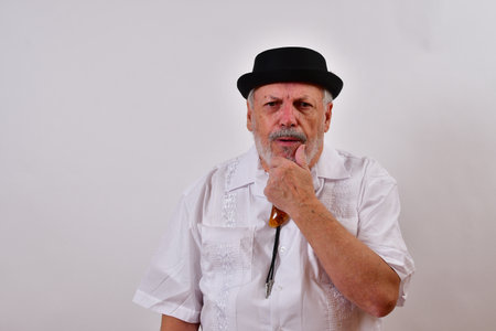 A thoughtful old gentleman looking worriedの写真素材