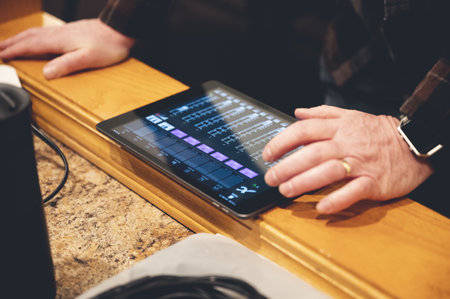 A male analyzing some statistics on a tablet