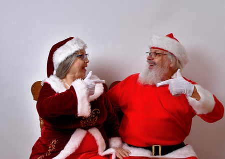 Lovely Mr and Mrs Santa Claus enjoying each other's companyの写真素材