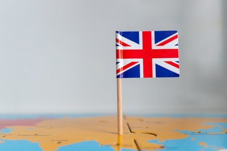 A small flag of the  on a wooden stick fixed on the globeの写真素材