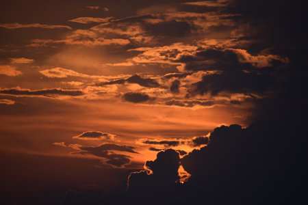 A mesmerizing orange sunset sky perfect for backgroundの写真素材
