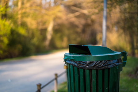 A trash can in a park in Munich. Those who recycle their waste help to protect nature and live in an environmentally friendly way.の写真素材