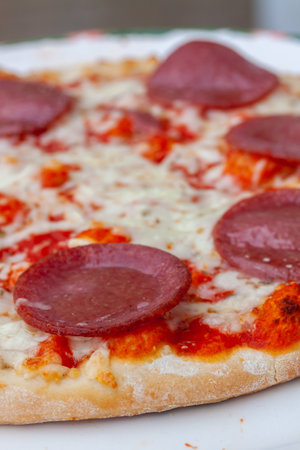A closeup shot of a pizza with pepperoniの写真素材