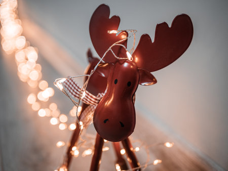 A closeup shot of a lovely deer statue covered with lightsの写真素材