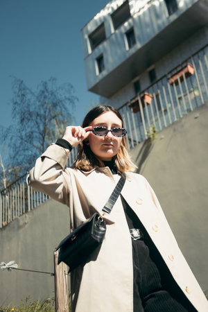 A lifestyle portrait of a young french businesswoman posing at camera in Lyon, France