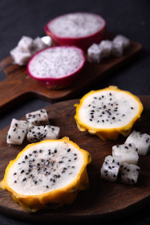 Dragon fruits cut out and exposed on dark backgroundsの写真素材