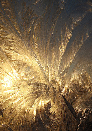 A vertical shot of pretty frost pattern on the windowの写真素材