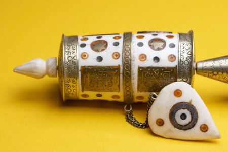 Upper part closeup of handhold small buddhist prayer mill.の写真素材