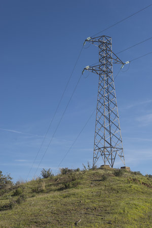 A vertical shot of an electricity tower in Tarnica, Wolosate, Poland