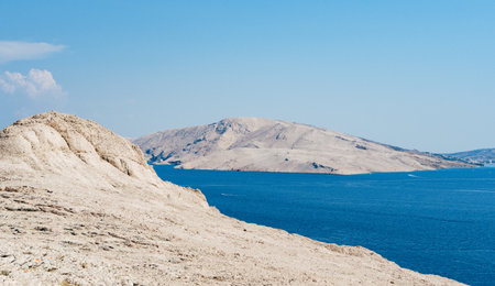 Amazing arid landscape and rocky coastline on Pag island in Croatia.の写真素材