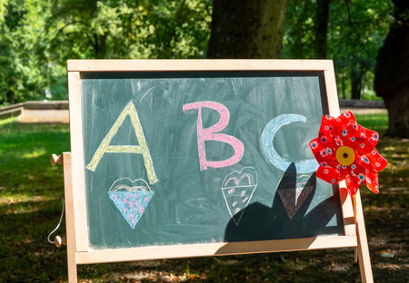 A small blackboard with decoration in nature for the start of schoolの写真素材