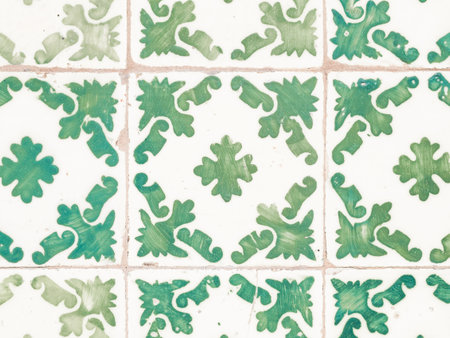 A closeup of green and white colored vintage Portuguese tiles in Porto, Portugal