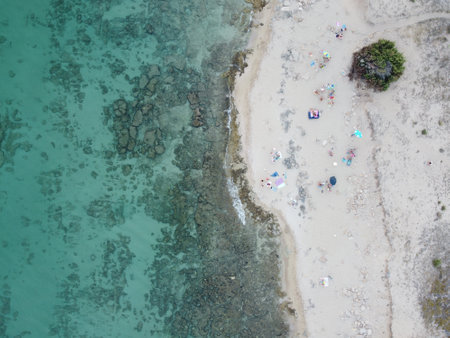 An aerial view of turquoise sea water at the beachの写真素材