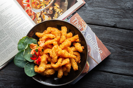 A top view of fried fish sticks on a plate on a tablの写真素材
