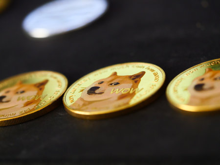A closeup of three Dogecoin cryptocurrency put on black surfaceの写真素材