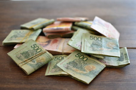 stacks of Argentine peso bills of 500 and 1000 pesos, symbol for inflationの写真素材