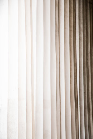 A vertical shot of fabric for curtains in shades of white, nude, and brownの写真素材