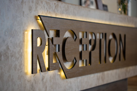 The reception sign on the desk in the hotelの写真素材