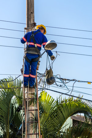 An electrician repairing electrical cablesの写真素材