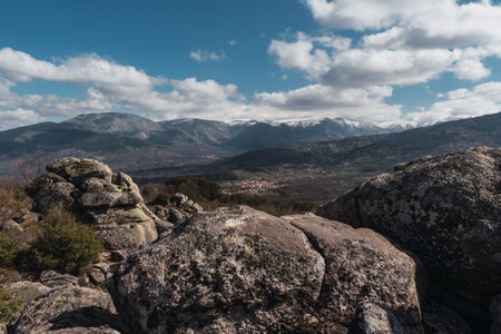A beautiful landscape of rocky mountains under a cloudy sky