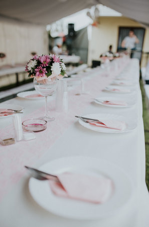 A beautiful wedding table setting with a floral arrangement
