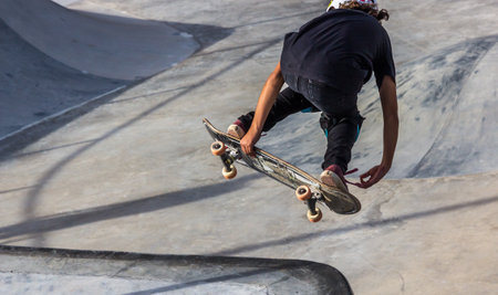 A closeup shot of a person skating in a skatepark