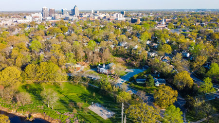 An aerial view of a church surrounded by greens and trees in Greensboro city, North Carolinaの写真素材