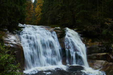 Autumn view of Mumlava river and waterfalls near Harrachovの写真素材