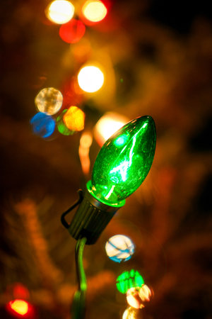 A vertical shot of Christmas light garlandsの写真素材