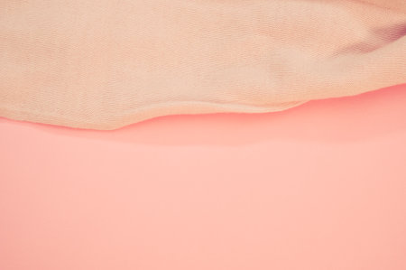 A closeup of a towel on a pink surfaceの写真素材