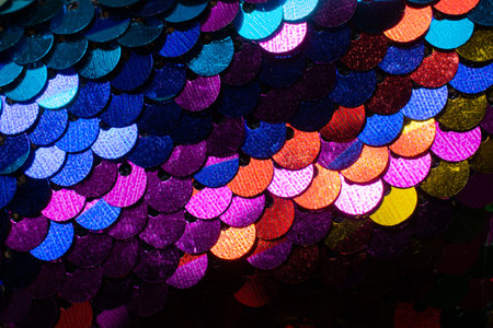 A closeup shot of colorful sequins for wallpaper and backgroundの写真素材