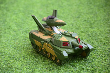 A plastic armored tank toy on the groundの写真素材