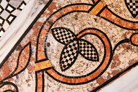 A stone mosaic with petal-shaped elements on the floor in Basilica di San Marco, Venice, Italy