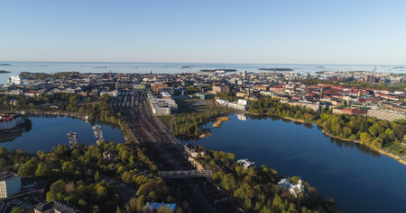 Aerial view of the downtown Helsinki cityscape and lake Toolonlahti, at golden hour sunrise, in Finlandの写真素材