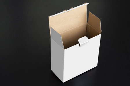 An empty opened cubical white box on black background, Psd smart object layers mockup templateの写真素材